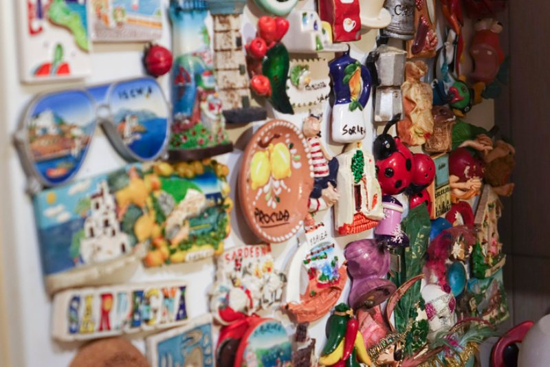 Old fridge magnets on a wall in Dallas, TX