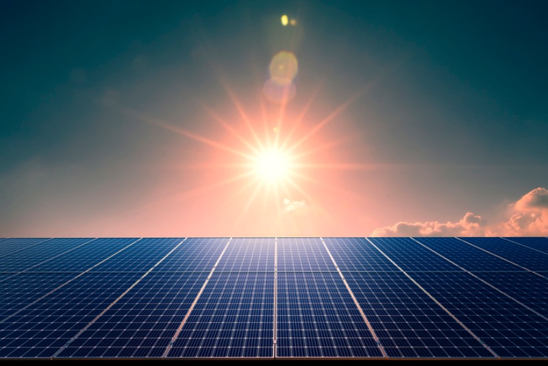 Solar panels in front of a sunset in Dallas, TX