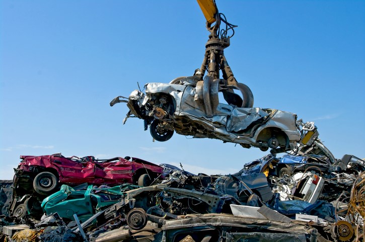Pile of mixed metal scrap parts and fixtures close-up in Dallas, TX